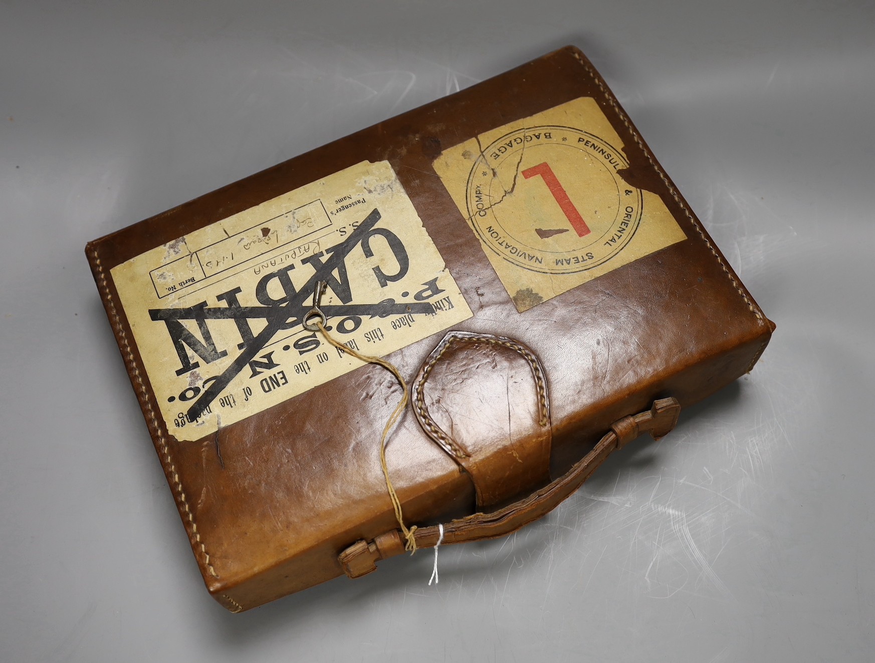 A 1920's leather travelling mahjong set